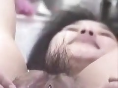 Korean slut with big pussy and pouty lips gets naughty on camera. She stuffs her hairy pussy with fingers, metal balls and even a bottle. This cunt can gulp a lot of jizz too!